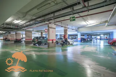 an empty parking garage with cars parked in it at Patacona Relax & Resort Apartments in Valencia