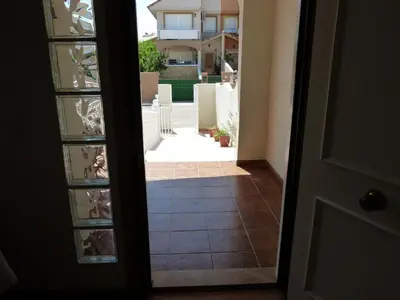 an open door with a view of a house at Adosado Calle Mar Cantabrico in Puebla de Vallbona