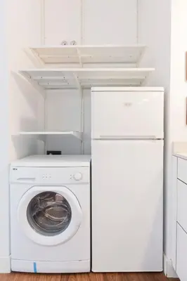 a white laundry room with a washer and dryer at Total Valencia Cathedral in Valencia