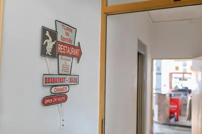 a group of signs on a wall next to a door at Hostal Virginia in Favareta