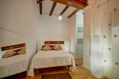 a kitchen with a counter with a sink and a stove at Beds & Breaks Boyvin in Valencia