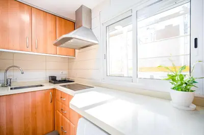 a kitchen with a sink and a window at Ático de Lujo Plaza Ayuntamiento in Valencia