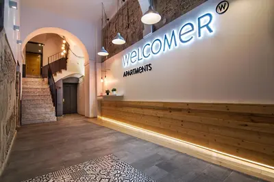 a store with a welcome sign on the wall at Welcomer Apartments Valencia in Valencia