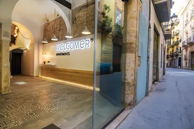 a view of a store window in a street at Welcomer Apartments Valencia in Valencia