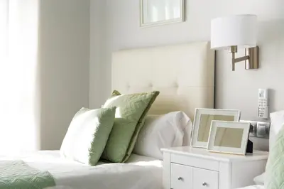 a bedroom with a bed and a table with a laptop at MD Vila Barbera in Valencia