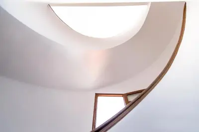 a staircase with a window in a white ceiling at MD Benlliure Cabañal Beach in Valencia
