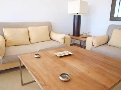 a living room with a coffee table and a couch at ApartUP Patacona Panoramic in Valencia