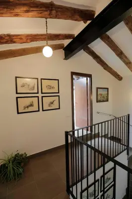 a living room with a staircase in a house at El Campillo, casa de campo cerca de la playa in Navajas
