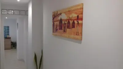 a painting hanging on a wall in a room at Apartment on Carrer del Dr. Lluch in Valencia