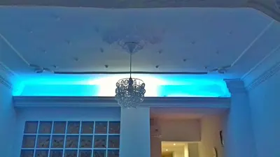 a chandelier hanging from a ceiling with blue lights at Apartment on Carrer del Dr. Lluch in Valencia