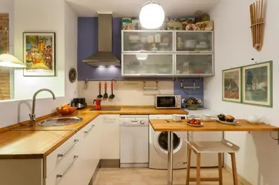 a kitchen with white cabinets and a dishwasher at My Loft 4 You Borgia in Valencia