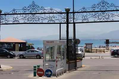a phone booth in a parking lot next to the ocean at Cap Blanc Penthouse Cullera in Faro de Cullera