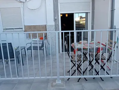 a balcony with a table and chairs on a porch at Lola Apartment Encorts in Valencia