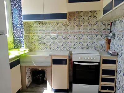 a kitchen with a sink and a stove at Lola Apartment Encorts in Valencia