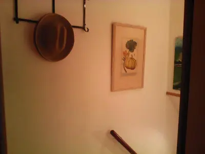 a wall with a pot and a picture on it at Lola Apartment Encorts in Valencia