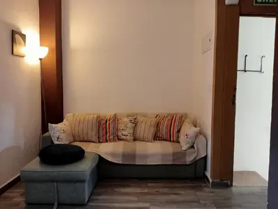 a living room with a couch with pillows at Lola Apartment Encorts in Valencia