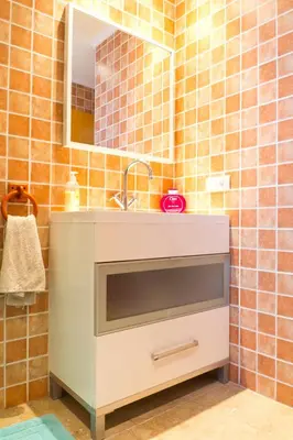 a bathroom with a sink and a mirror at My Penthouse Valencia in Valencia