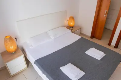 a bedroom with a large bed with two night stands at Quart Silence in Valencia