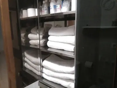 a rack of towels and towels in a bathroom at Apartamento Ciudad de las Ciencias in Valencia