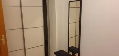 a mirror in a room with a toilet in it at Apartamento Ciudad de las Ciencias in Valencia