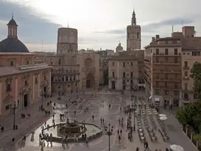 a group of people walking around a plaza in a city at Apartamento Ciudad de las Ciencias in Valencia