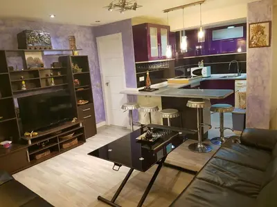 a kitchen with a couch and a table in a room at Balandra Flat in Valencia