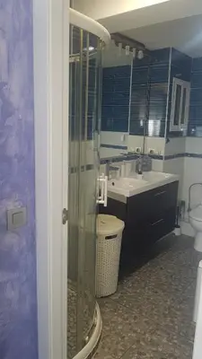 a bathroom with a shower and a sink and a toilet at Balandra Flat in Valencia