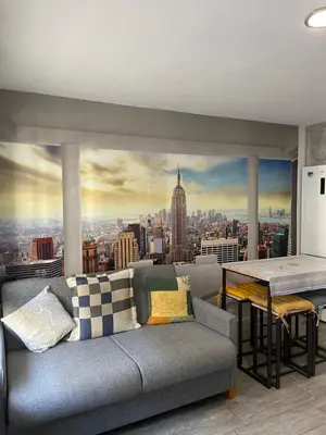 a living room with a couch and a table at Apartment near Arts & Science in Valencia