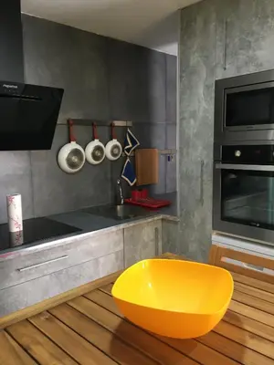 a kitchen with a yellow bowl on the floor at Apartment near Arts & Science in Valencia