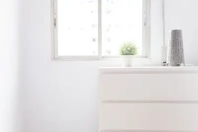 a white kitchen with a sink and a window at Apartamento Cardenal in Valencia