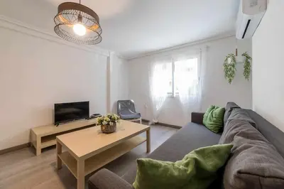 a living room with a couch and a table at Piso Carolina in Valencia