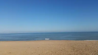 a beach with the ocean in the background at Apartamento con Vista al Mar in Tavernes de Valldigna