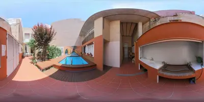 a building with a pool in the middle of it at B&B 