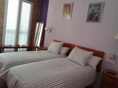 a bedroom with a large bed with two pillows at B&B 