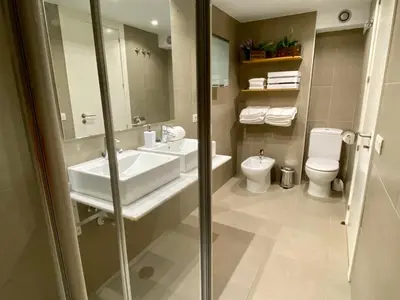 a bathroom with a sink and a toilet at La casita de Palomar - PalomarGroup in Valencia
