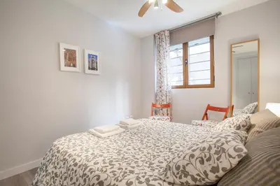 a bedroom with a large bed and a window at Apartamento Alta in Valencia