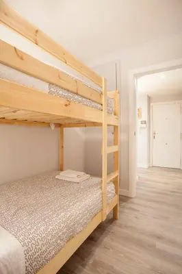 a bedroom with two bunk beds in a room at Apartamento Alta in Valencia