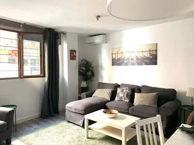 a living room with a couch and a table at Apartamento Alta in Valencia