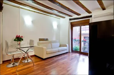 a living room with a couch and a table at Sun Studio Valencia in Valencia
