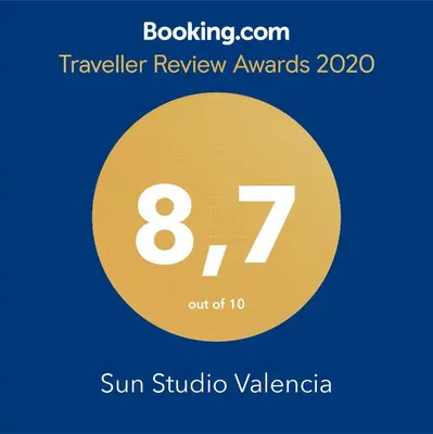 a yellow circle with the number eight and the sun symbol at Sun Studio Valencia in Valencia