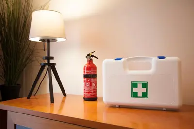 a lamp and a white box on a table next to a bottle at Apartamento Fos in Valencia