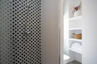 a shower with a glass door in a bathroom at SingularStays Ático Roger de Flor in Valencia