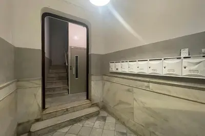 a bathroom with a mirror and stairs in a building at SingularStays Ático Roger de Flor in Valencia