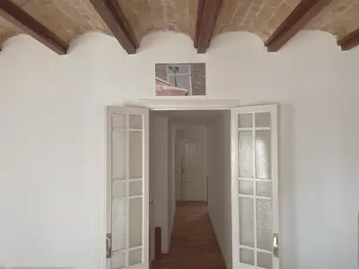 a hallway with white walls and a ceiling at Calatrava in Valencia