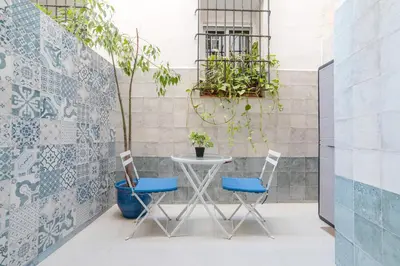 a patio with two chairs and a table at Cisneros flat in Valencia