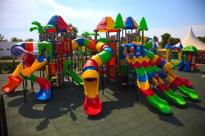 a playground with a brightly colored playground at Devesa Gardens in El Saler