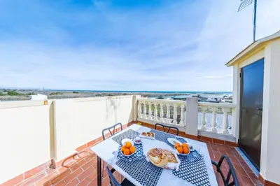 a balcony with a table with food and pumpkins on it at Casa Pescadores de Vallterra in El Palmar