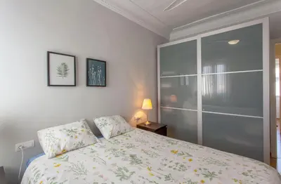 a bedroom with a bed and a glass wall at Apartment City of Arts and Sciences 2 in Valencia