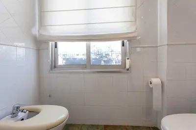 a bathroom with a sink and a window at Apartment City of Arts and Sciences 2 in Valencia