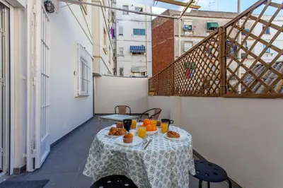 a table with oranges on it on a balcony at Apartment City of Arts and Sciences 1 in Valencia